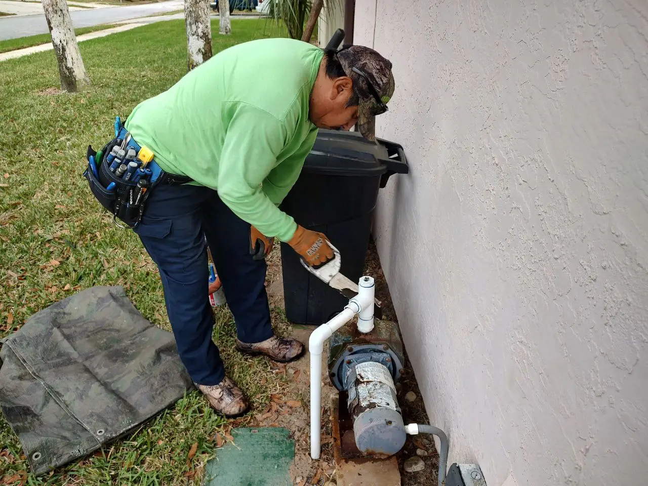 Technician working on a sprinkler system.